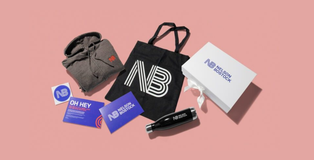 Image: Branded merch swag boxes, New Balance branded tote, boxes, waterbottle