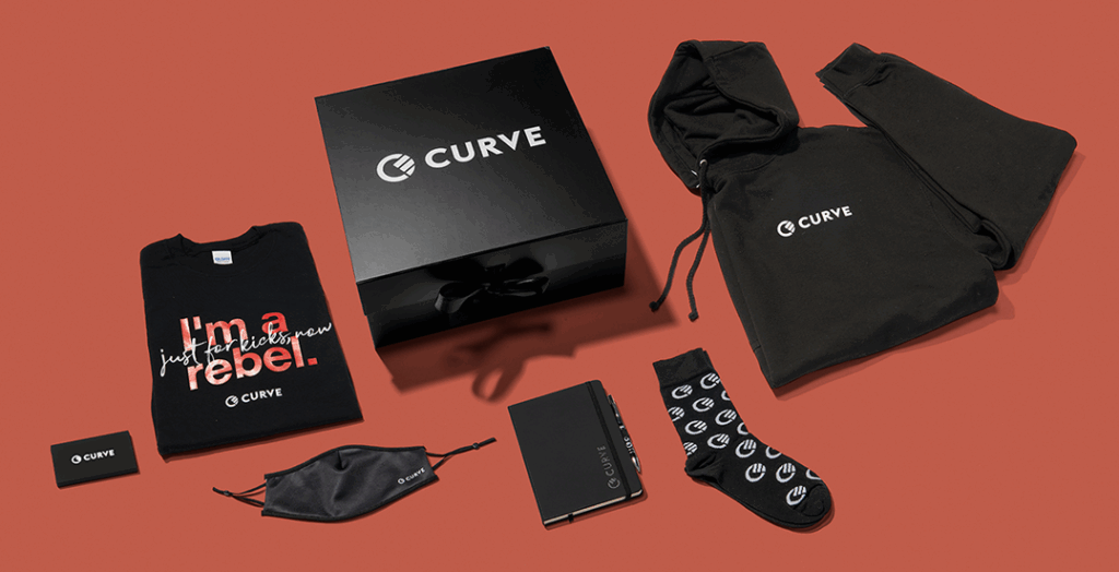 Curve fintech bank swag, with branded socks on a terracotta background