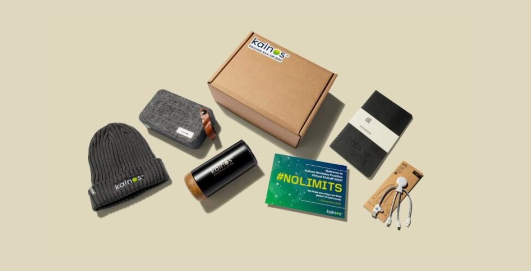 Image: Event merch for Kainos, including a branded beenie, water bottle, USB, and a brand digital radio
