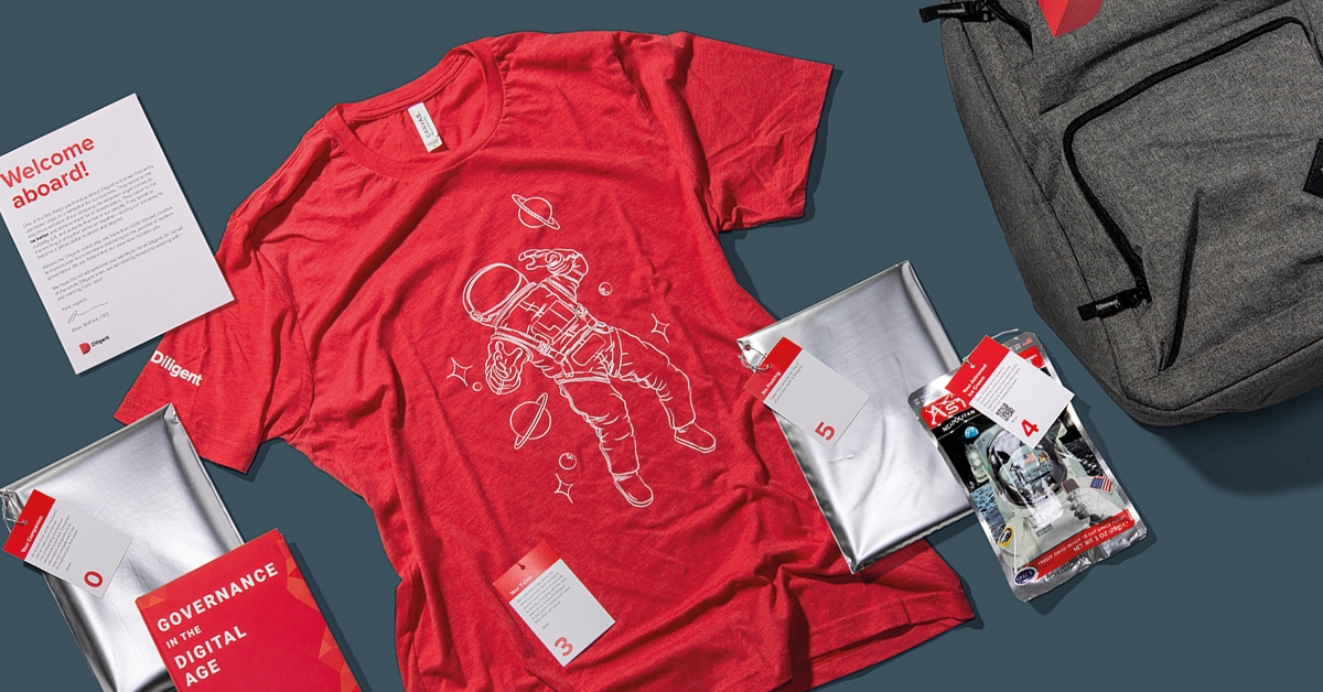 Image:Various swag items inc a tshirt, with company brandinf