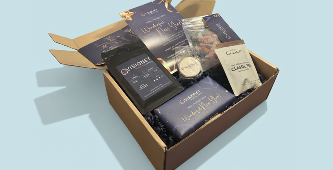 Image showing a beautifully branded box of branded swag goodies for Visionet 