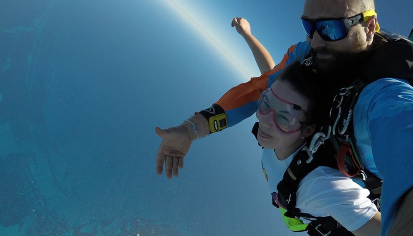 Erin doing a tandem skydive 14000 feet in the air